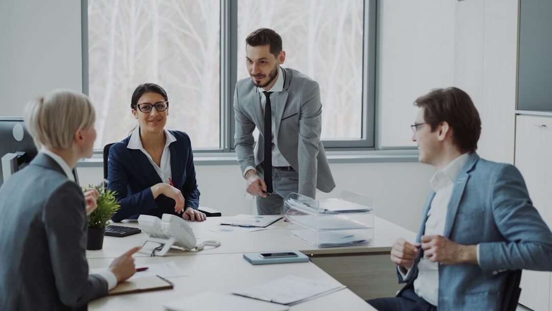 Group of professionals engaged in a civic discussion around a table